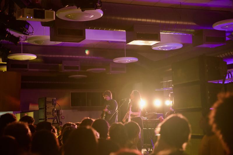Karly Hartzman and the Wednesday band are seen performing on stage above the crowd. Photo taken by Molly Shoffner for Wavelength.