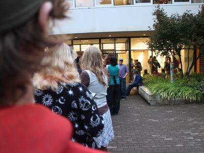 Over the shoulder shot of students waiting in line before the concert