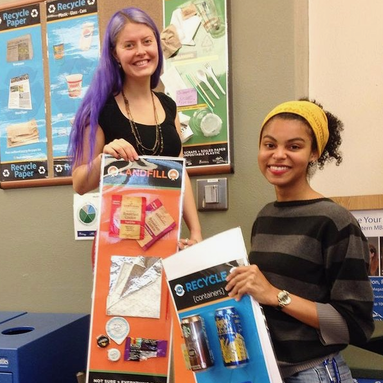 Students hanging posters