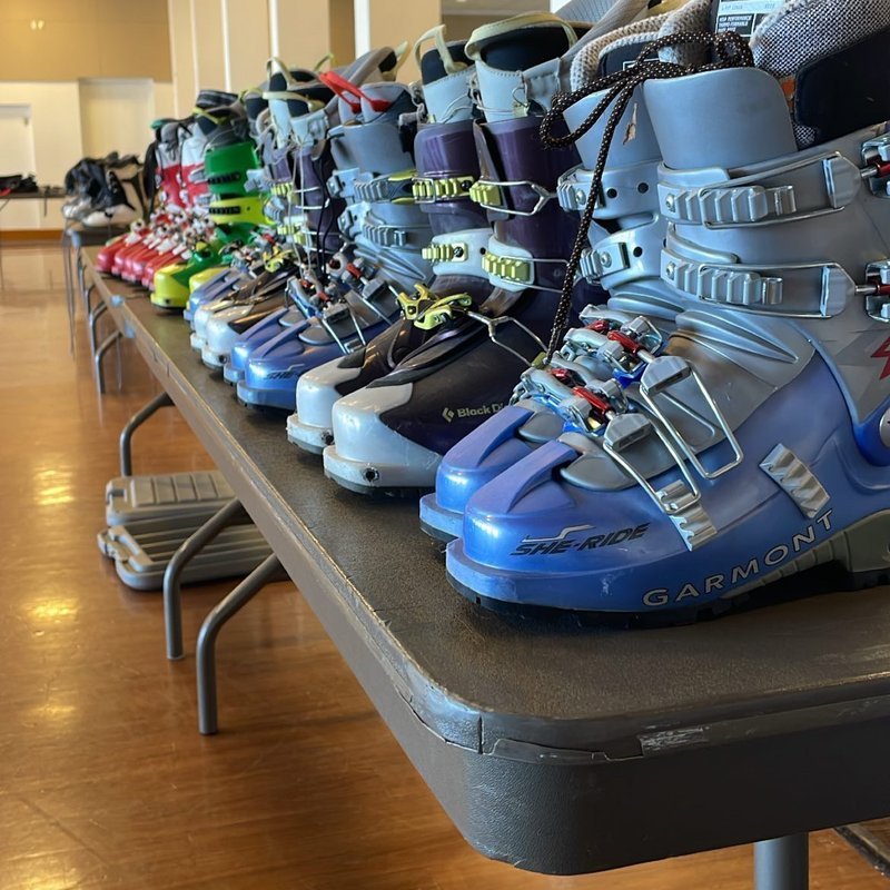 Table of ski boots at Gear Grab