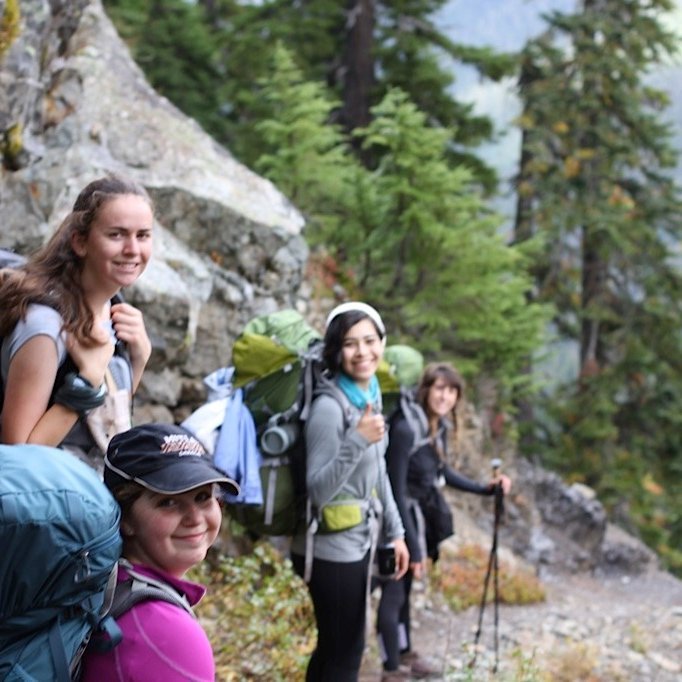 Smiling hikers in the forest