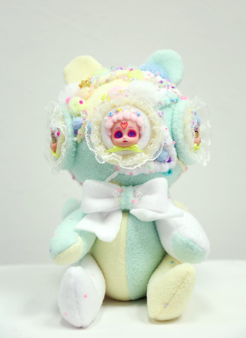 Multimedia soft sculpture in pastel tones resembling a stuffed animal front view.jpg