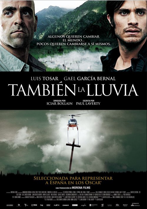 movie poster for Even The Rain, featuring the two main stars, Luis Tosar and Gael Garcia Bernal. Also shows a helicopter airlifting a huge wooden cross