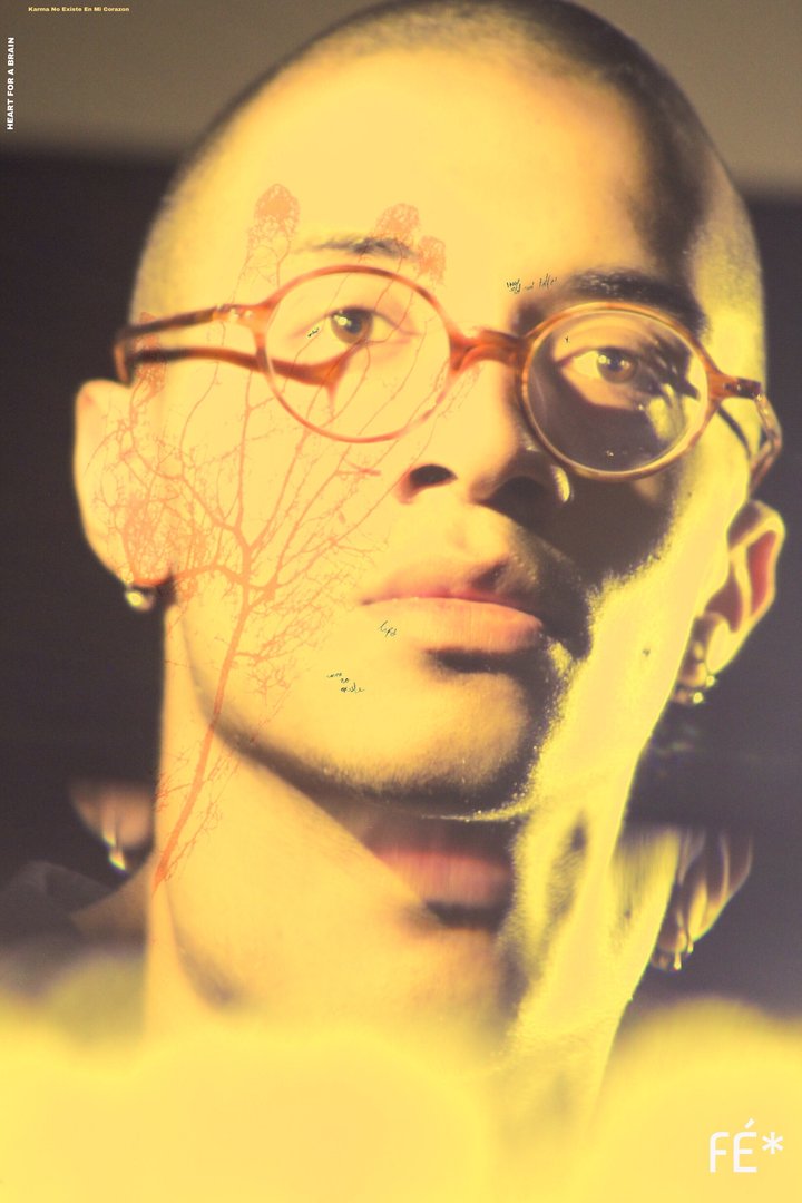 digitally edited photograph of Brandon Santana wearing glasses with warm yellow tones