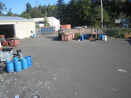 Recycle Center compound, with dumpsters and blue bins